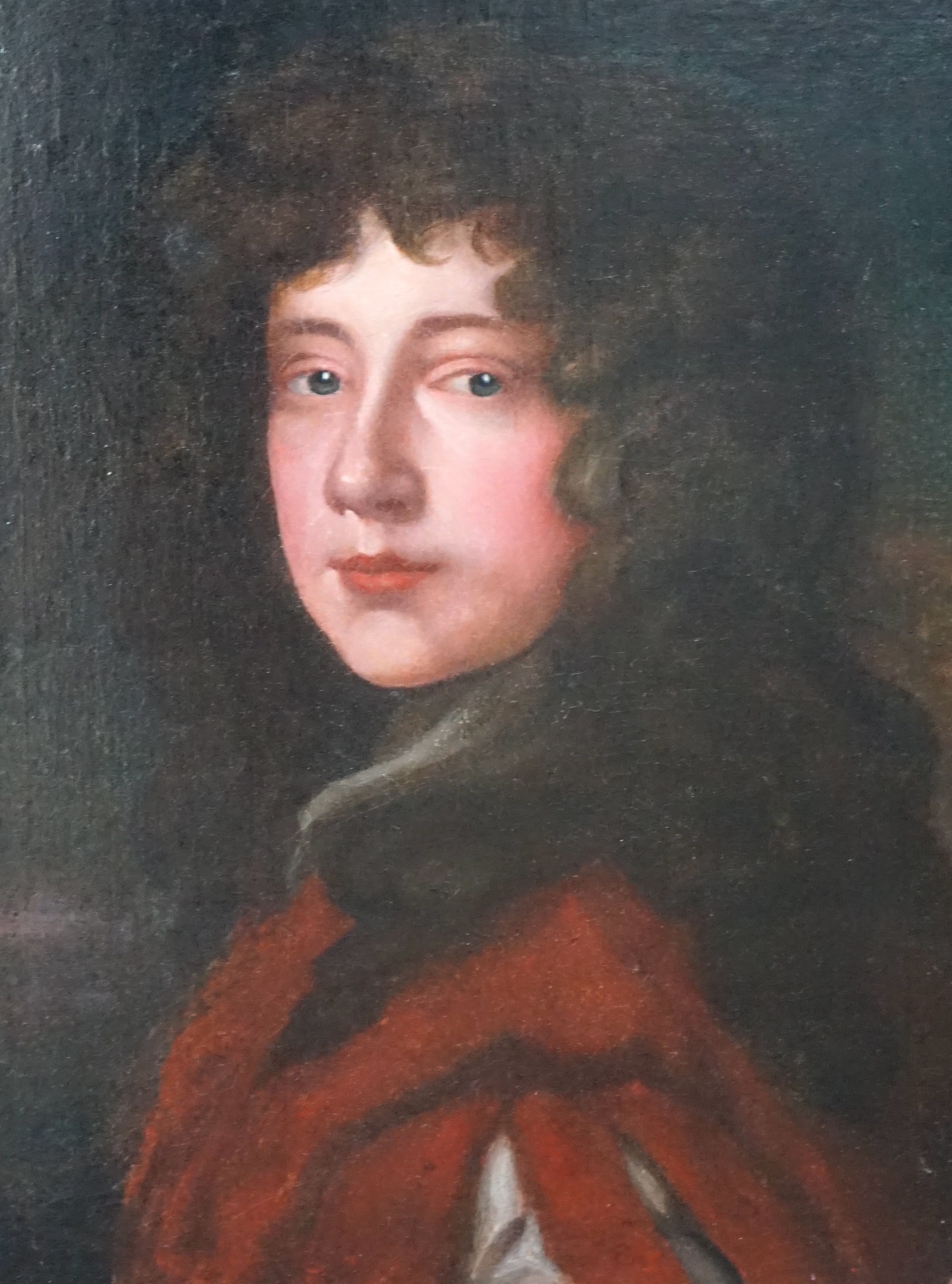 After Sir Peter Lely (1618-1680), oil on canvas, Head and shoulders portrait of a young gentleman, 48 x 37cm, ornate gilt framed. Condition - fair, re-lined